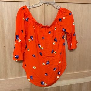 Off the shoulder women’s floral shirt.